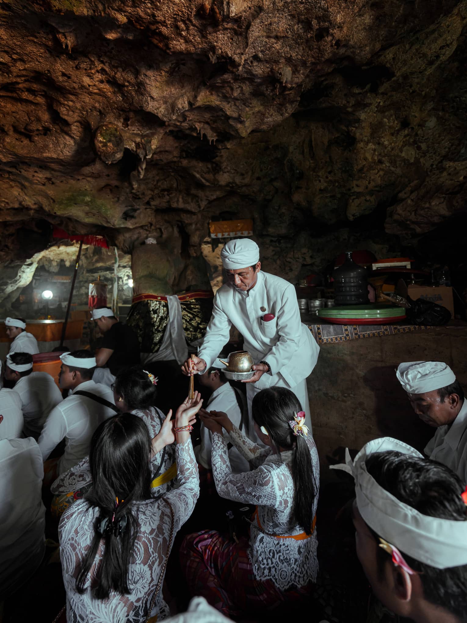 A healing ritual is performed within a cave temple