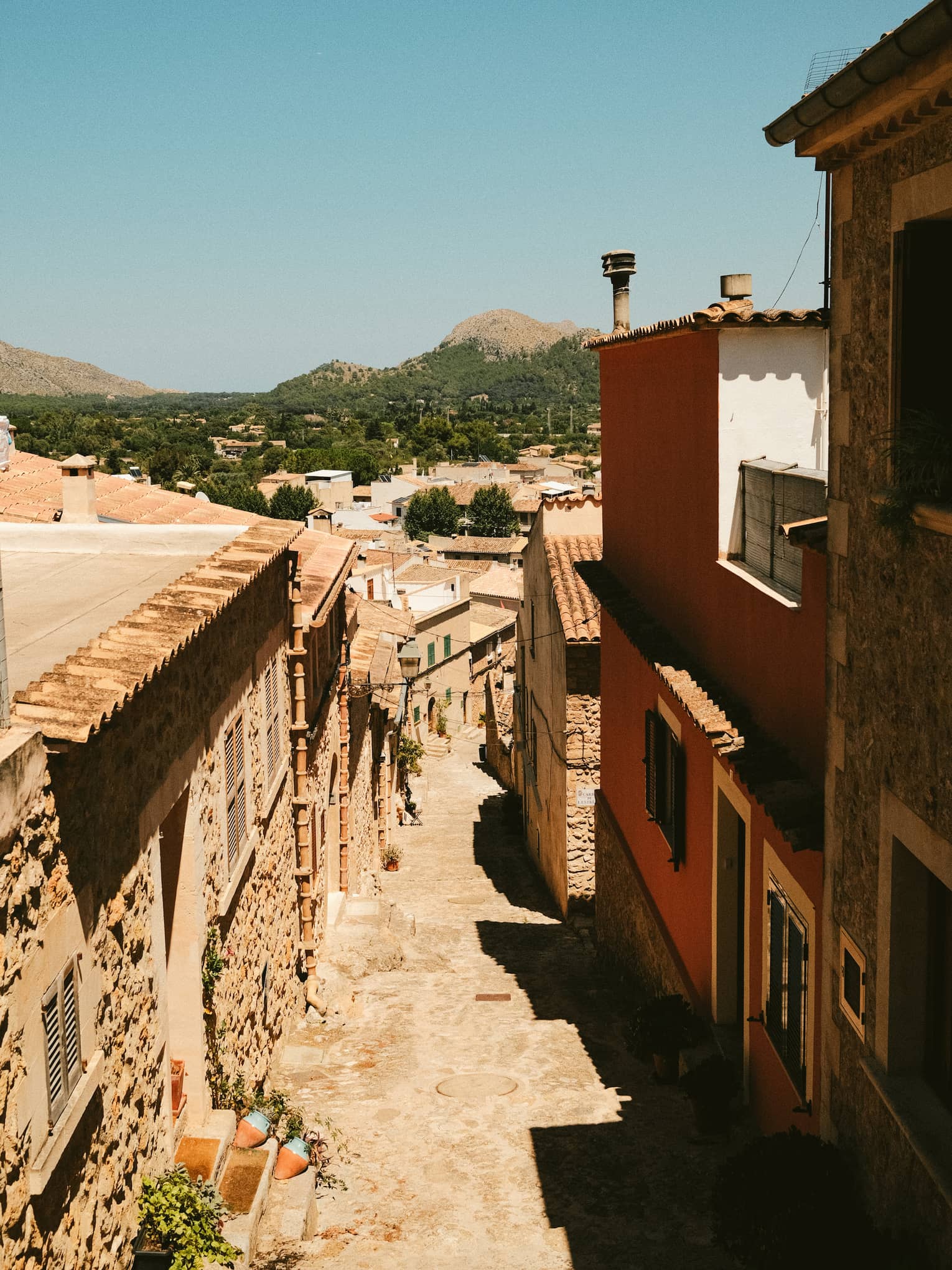 Cobblestone street lined with buildings