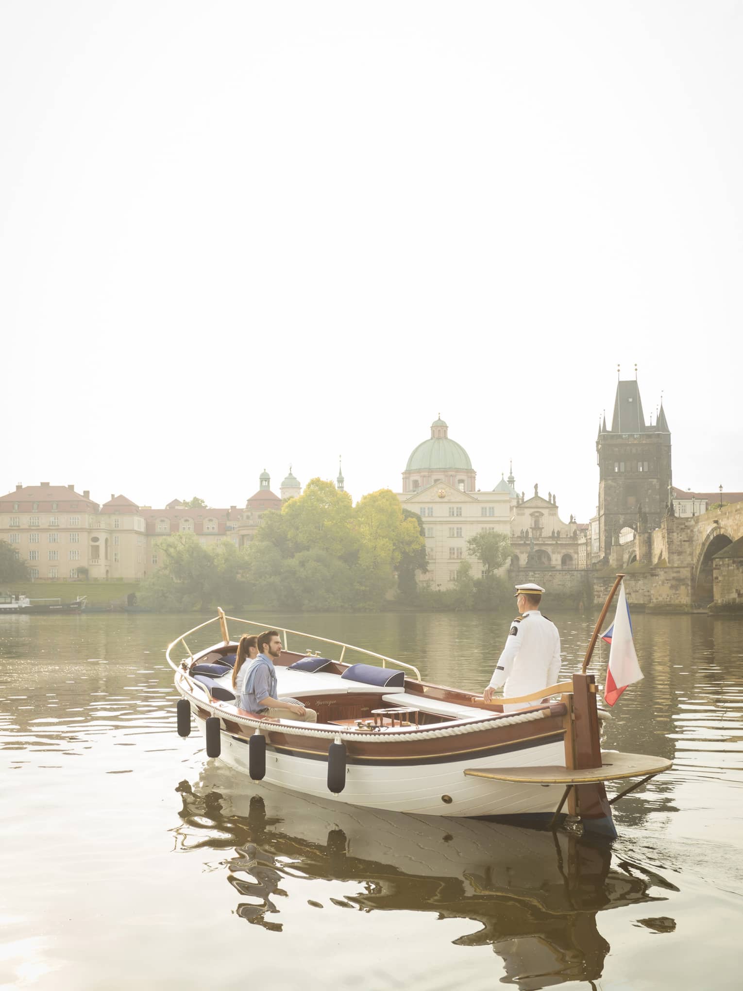 Couple enjoying river boat trip in Prague
