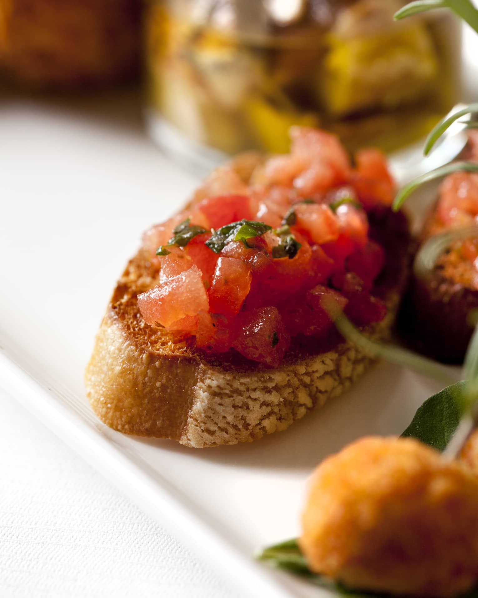 Italian antipasti sharing starter dish featuring mini bruschetta