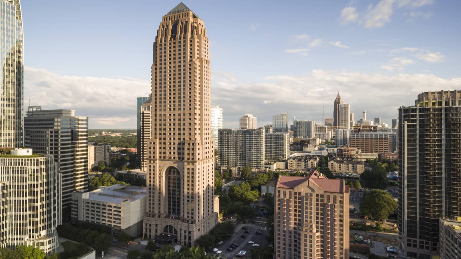 Four Seasons Hotel Atlanta building towering over Midtown on sunny day