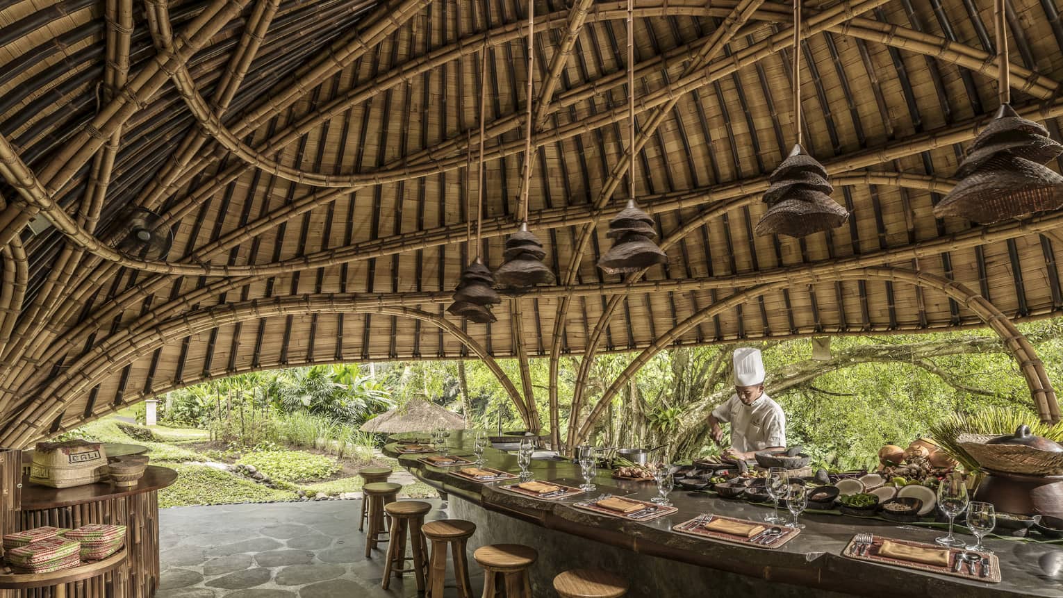 A chef prepares for Sokasi Cooking School in a bamboo pavillion