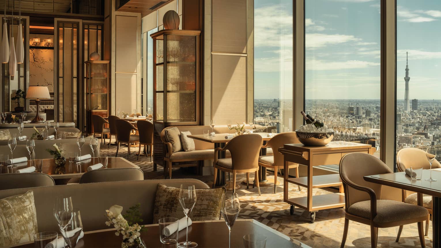 Hotel restaurant with floor to ceiling views of city
