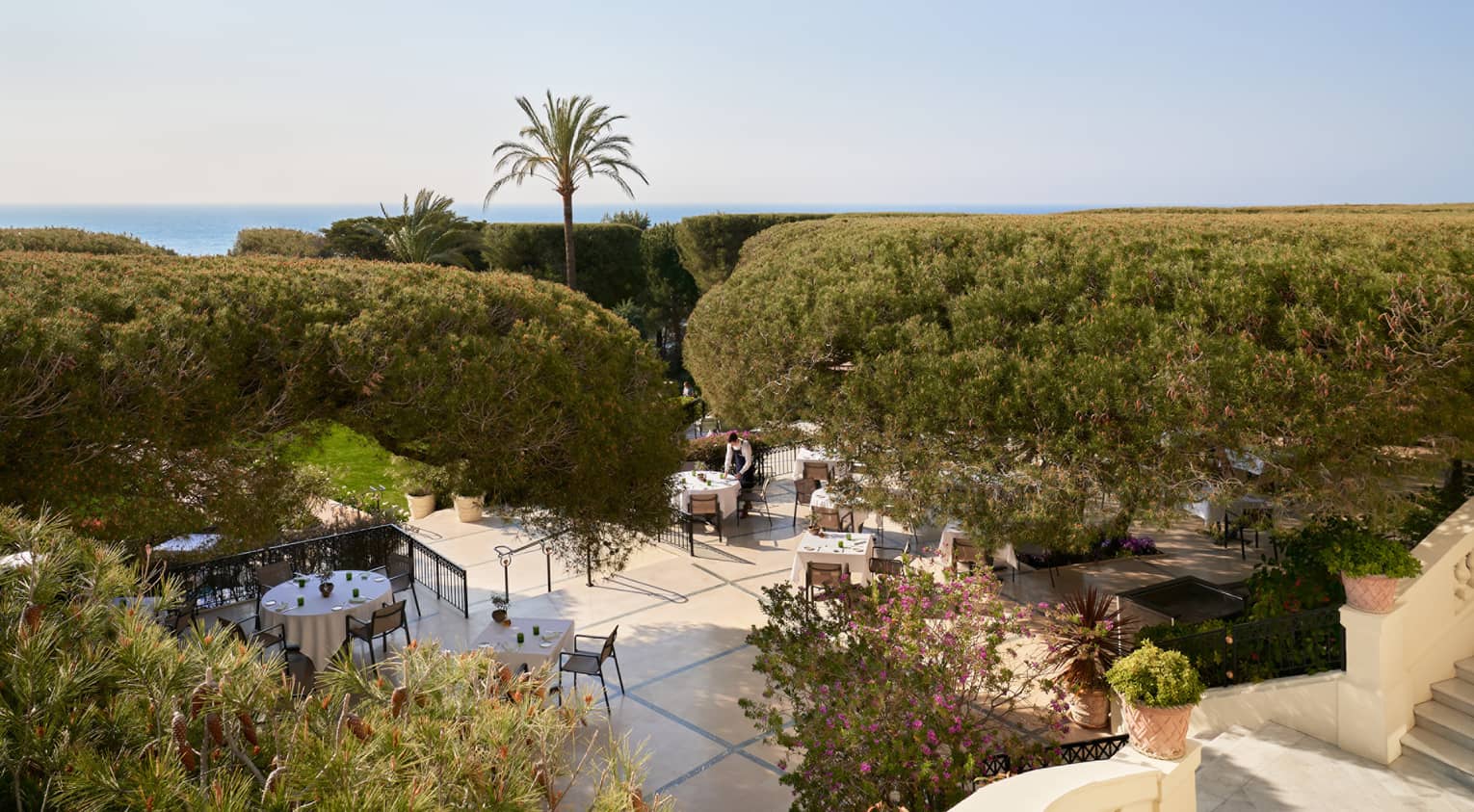 Bird’s-eye view of outdoor fine dining at luxury hotel