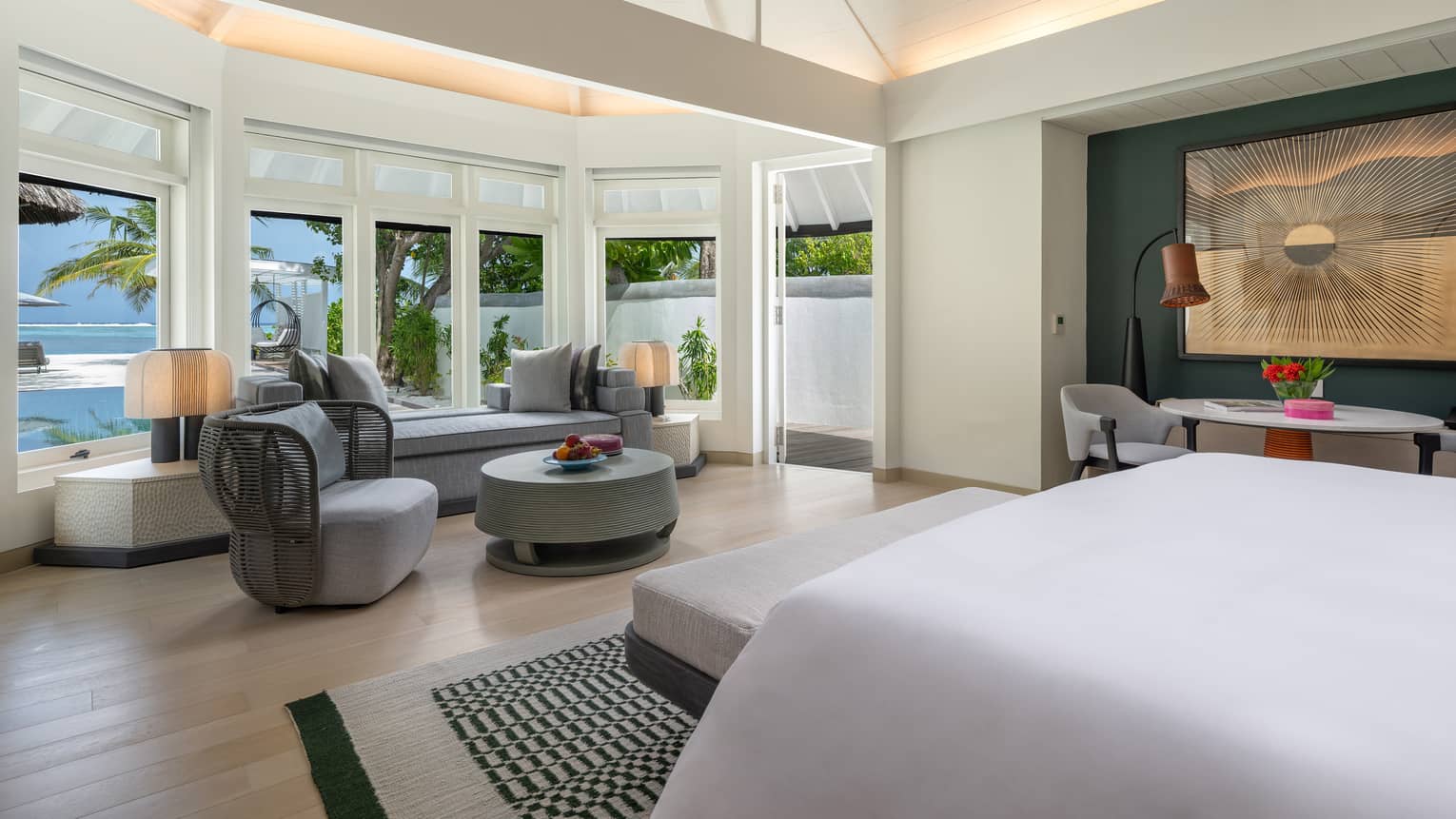 Inside the primary bedroom of the sunrise family beach villa with pool
