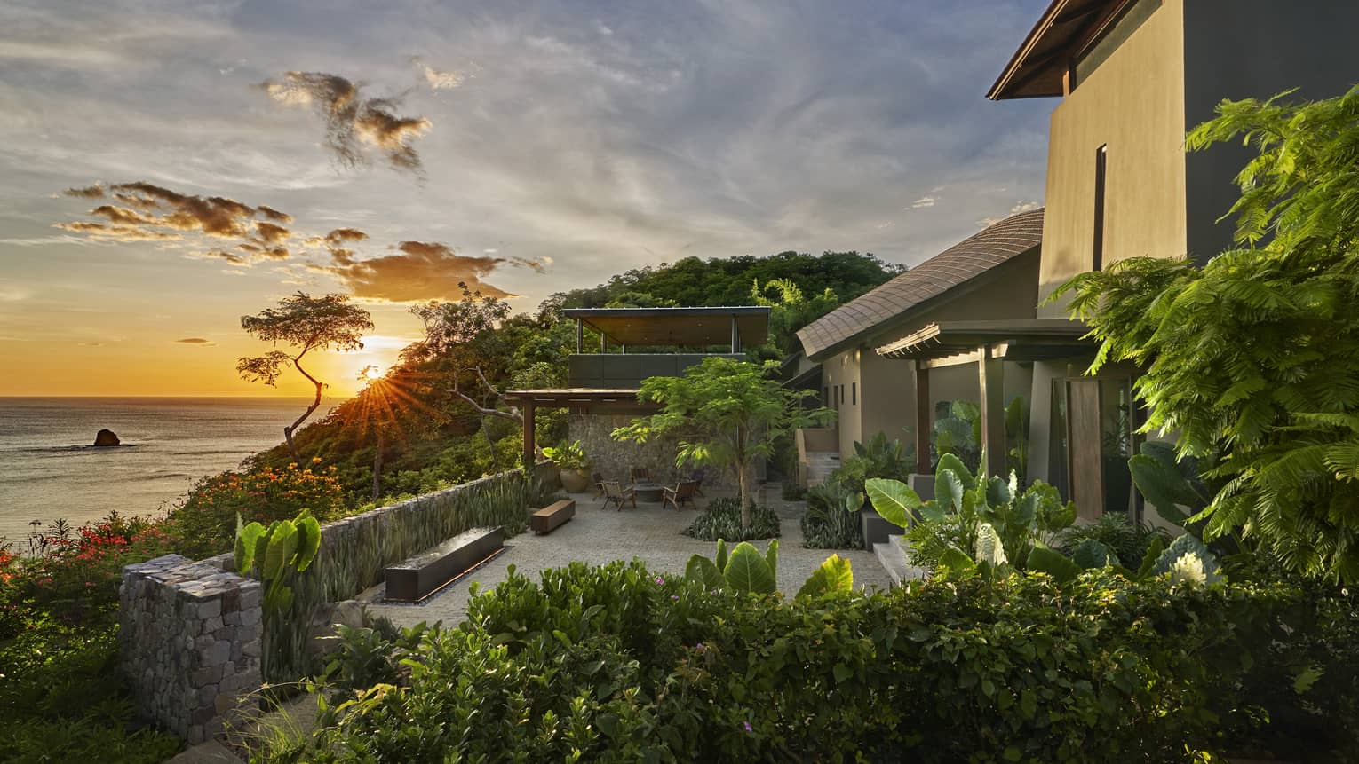 Villa terrace overlooking sea at sunset