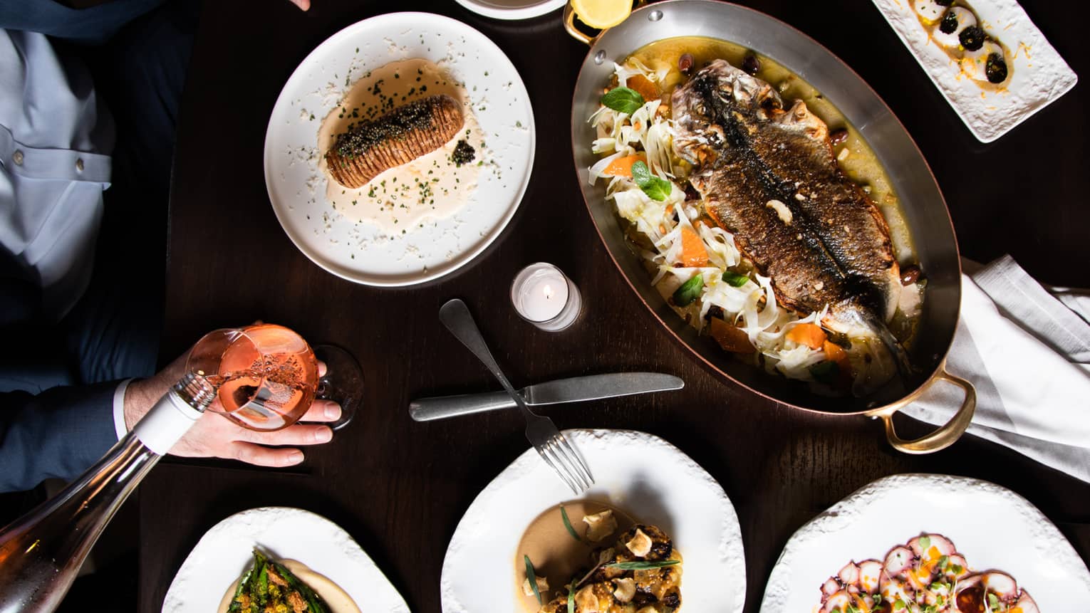 An assortment seafood on white plates.