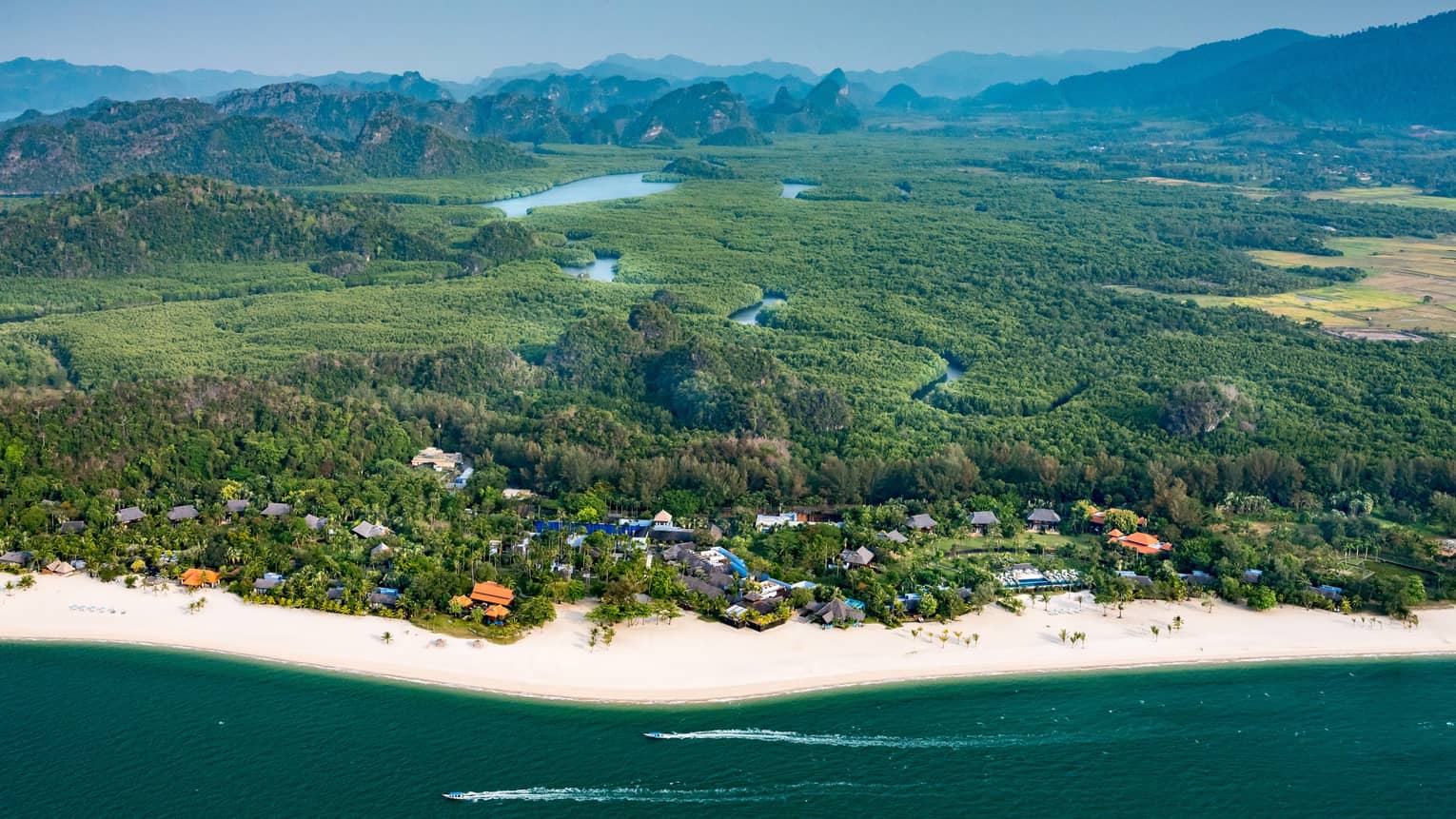 Aerial view of Four Seasons Langkawi Malaysia resort coastline, rainforest