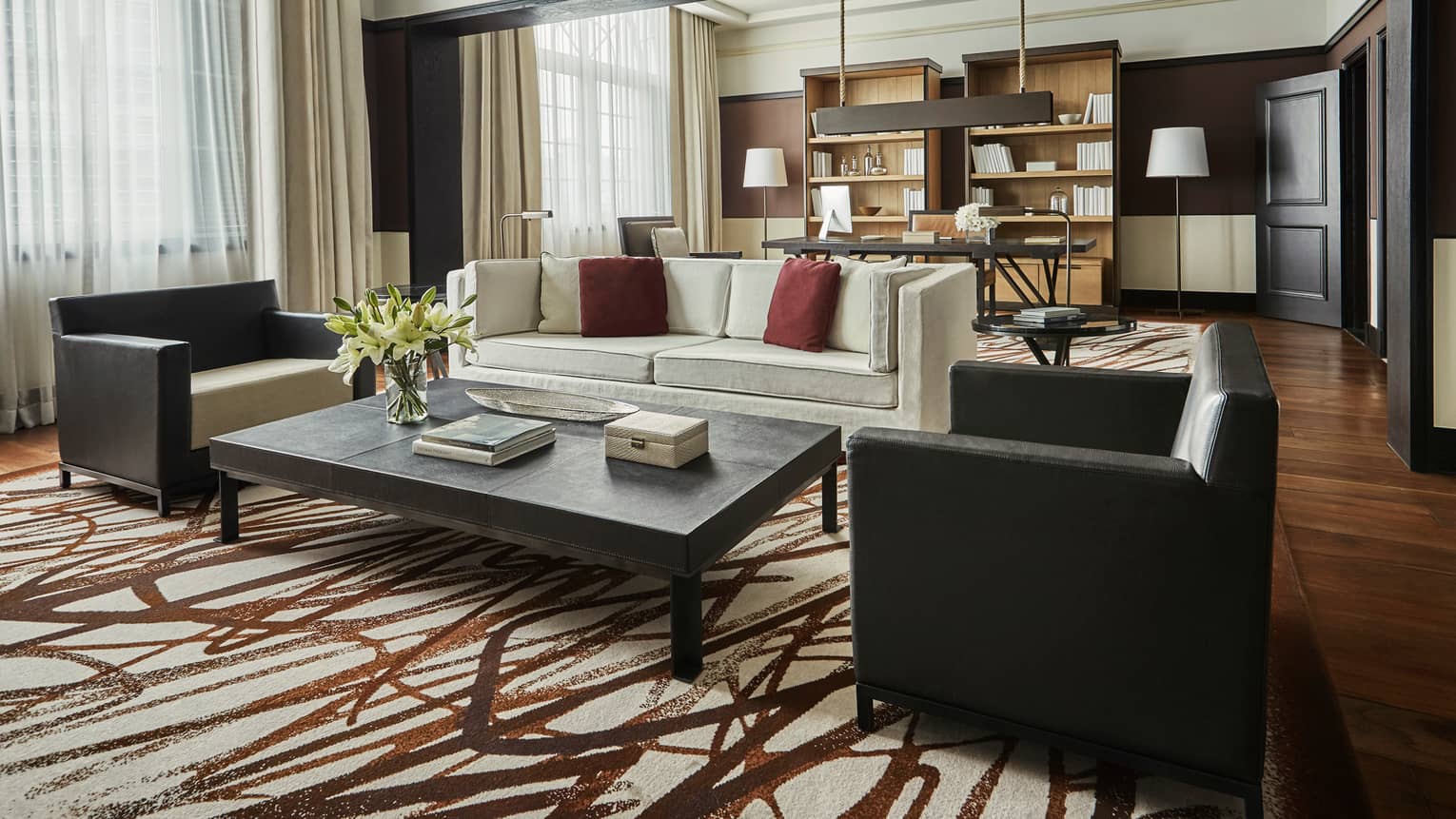 Bright Governor Suite sofa and two armchairs by coffee table, brown-and-white rug