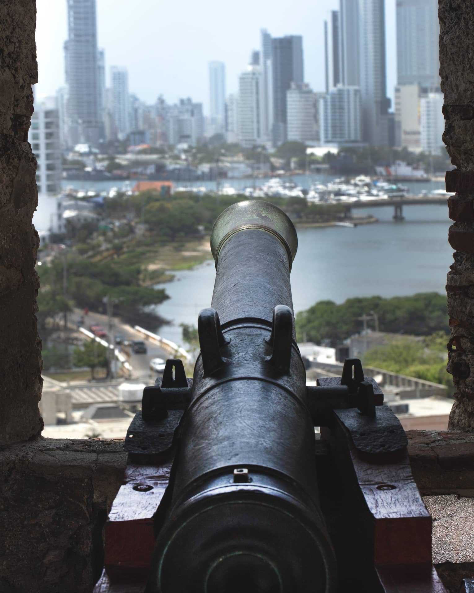 An antique cannon in a city setting