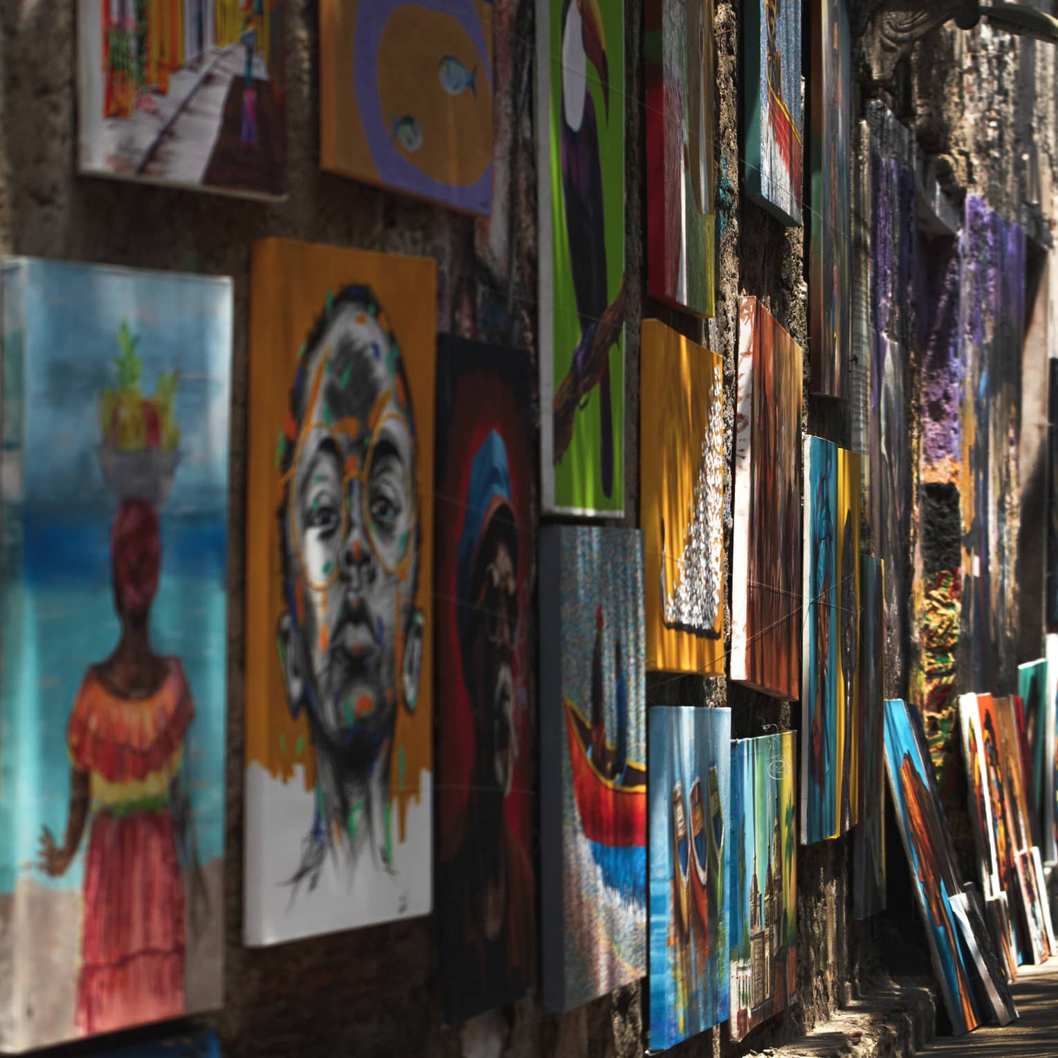 City street with colourful artwork on a wall