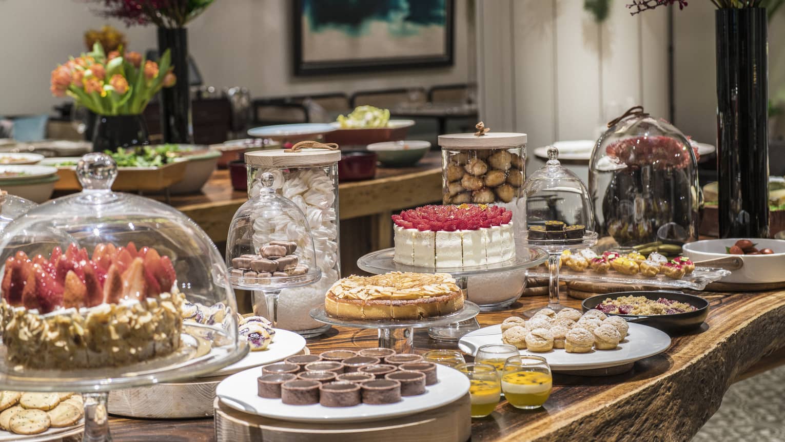 An arrangement of a variety of decadent desserts including cakes, tarts and soufflés 