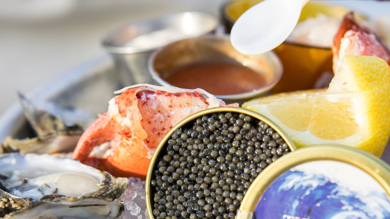 Caviar, Maine lobster, Shigoku oysters, seasonal crudos and jumbo prawns served on ice with lemon slices and small bowls of sauce