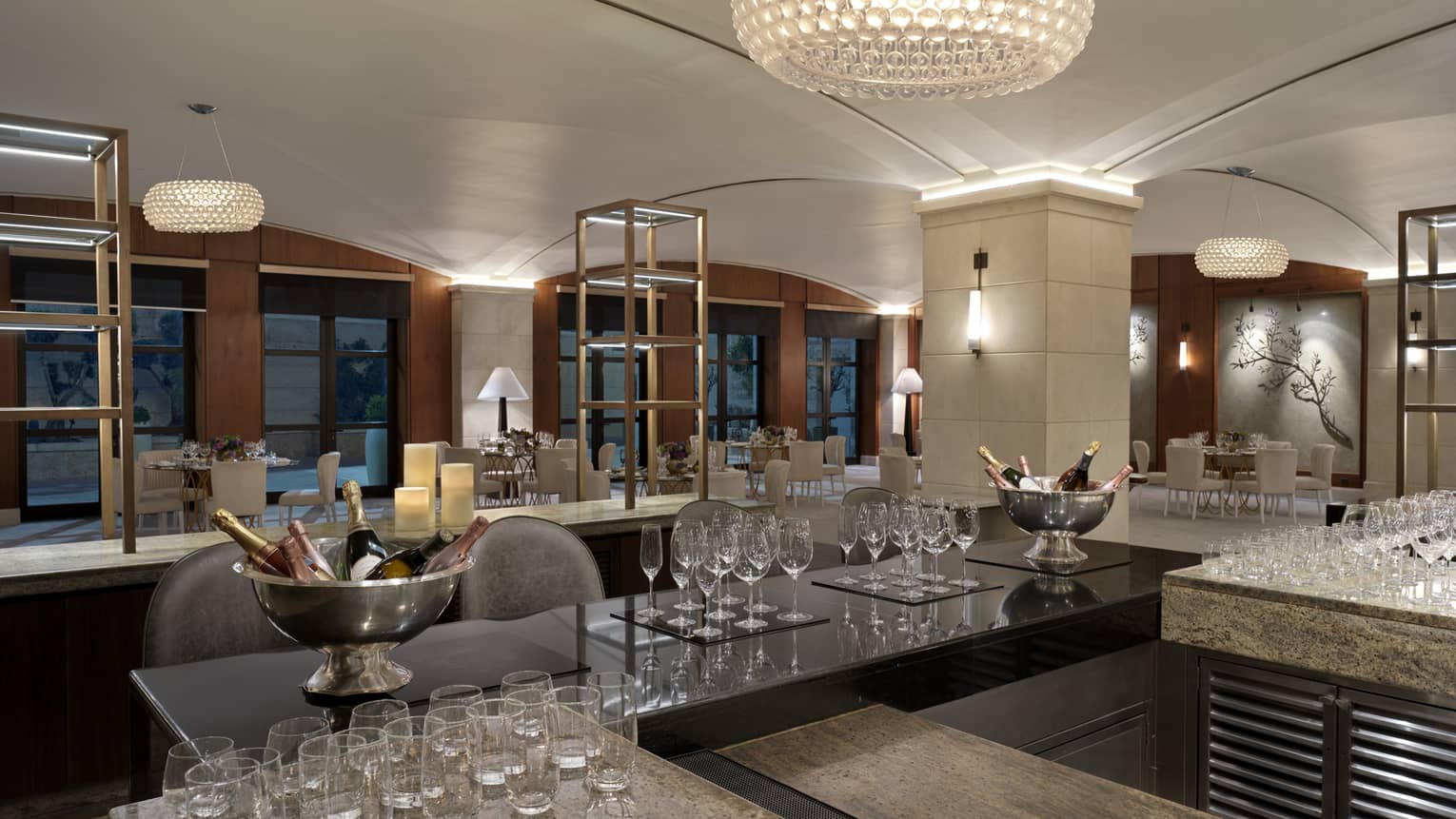 Bar counter in a private dining room with various glassware on the counter