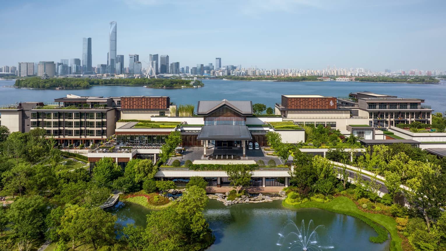 Exterior of Four Seasons Hotel Suzhou, with Jinji Lake and city centre in the background