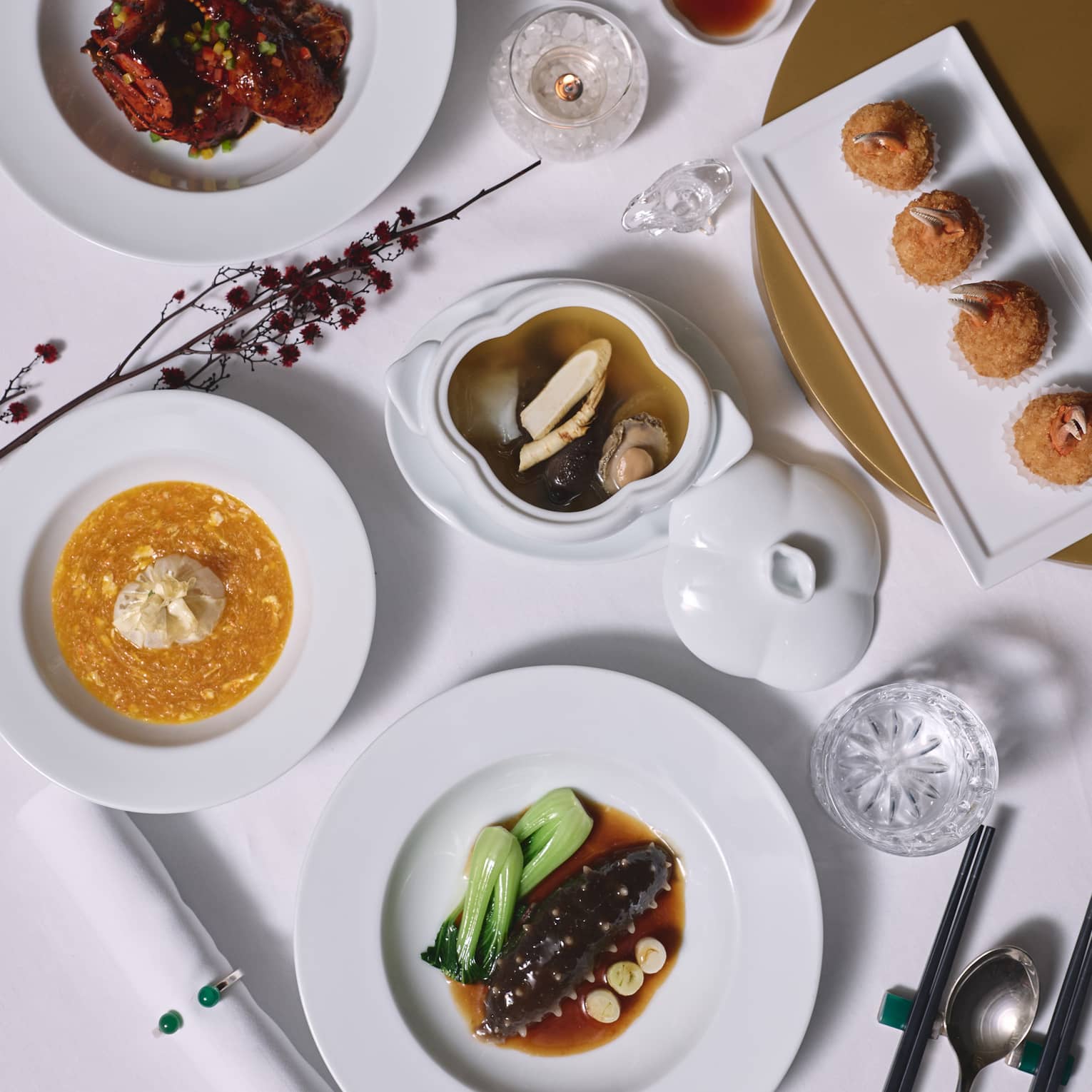 Asian dishes set on a white table