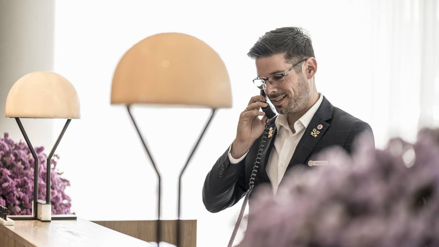 The concierge happily assists guests over the phone 