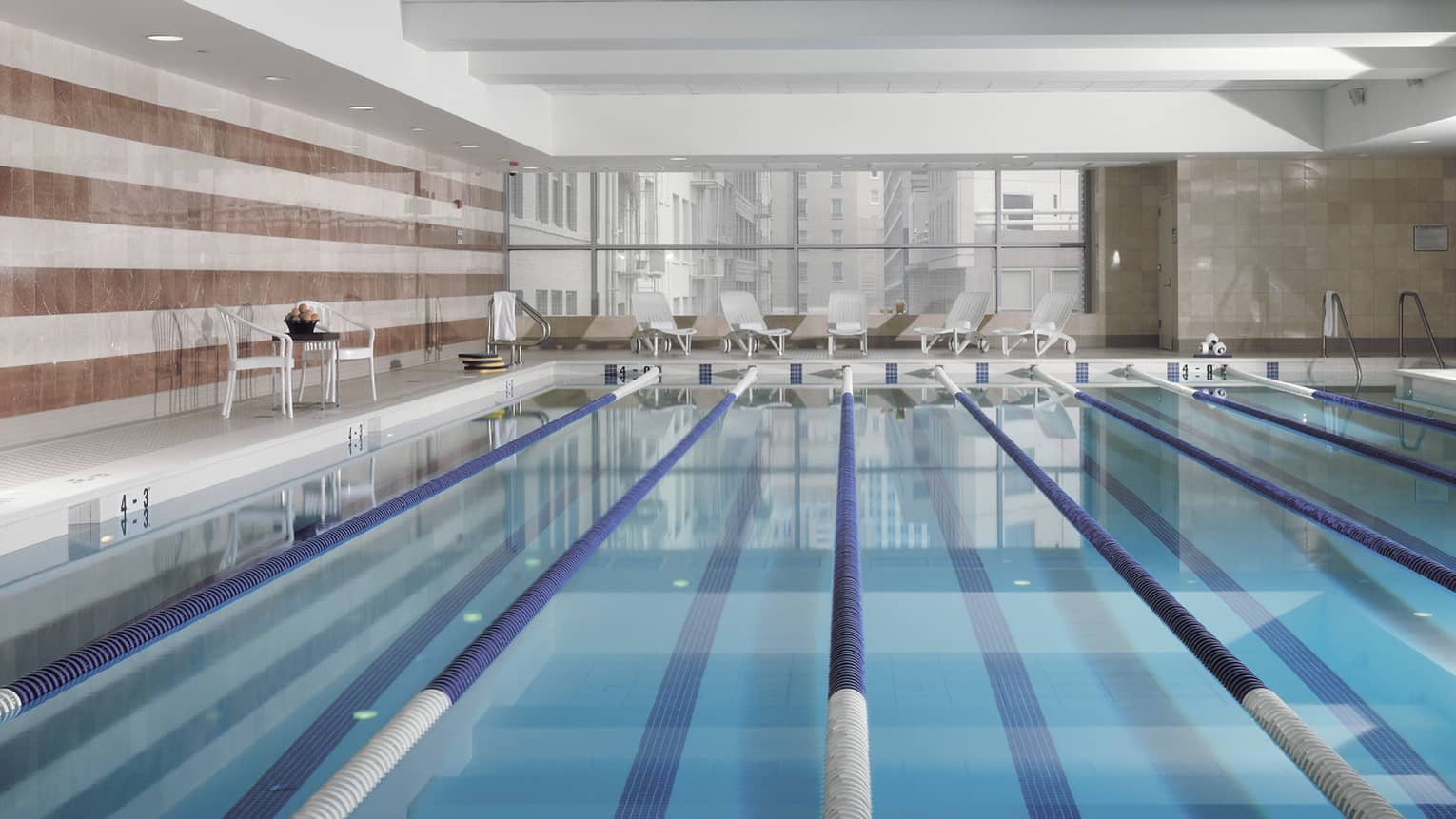 View across indoor swimming pool with divided lanes 