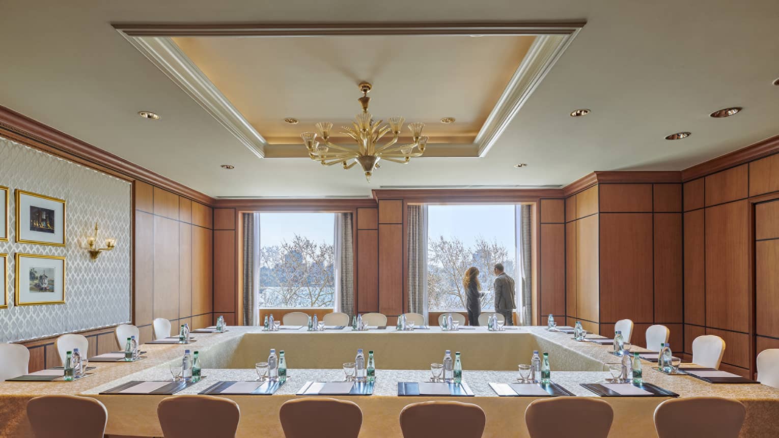 Modular conference tables in Citadel meeting room, two people at window