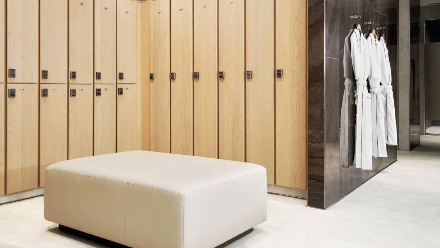 Locker room with robes hanging on the wall.