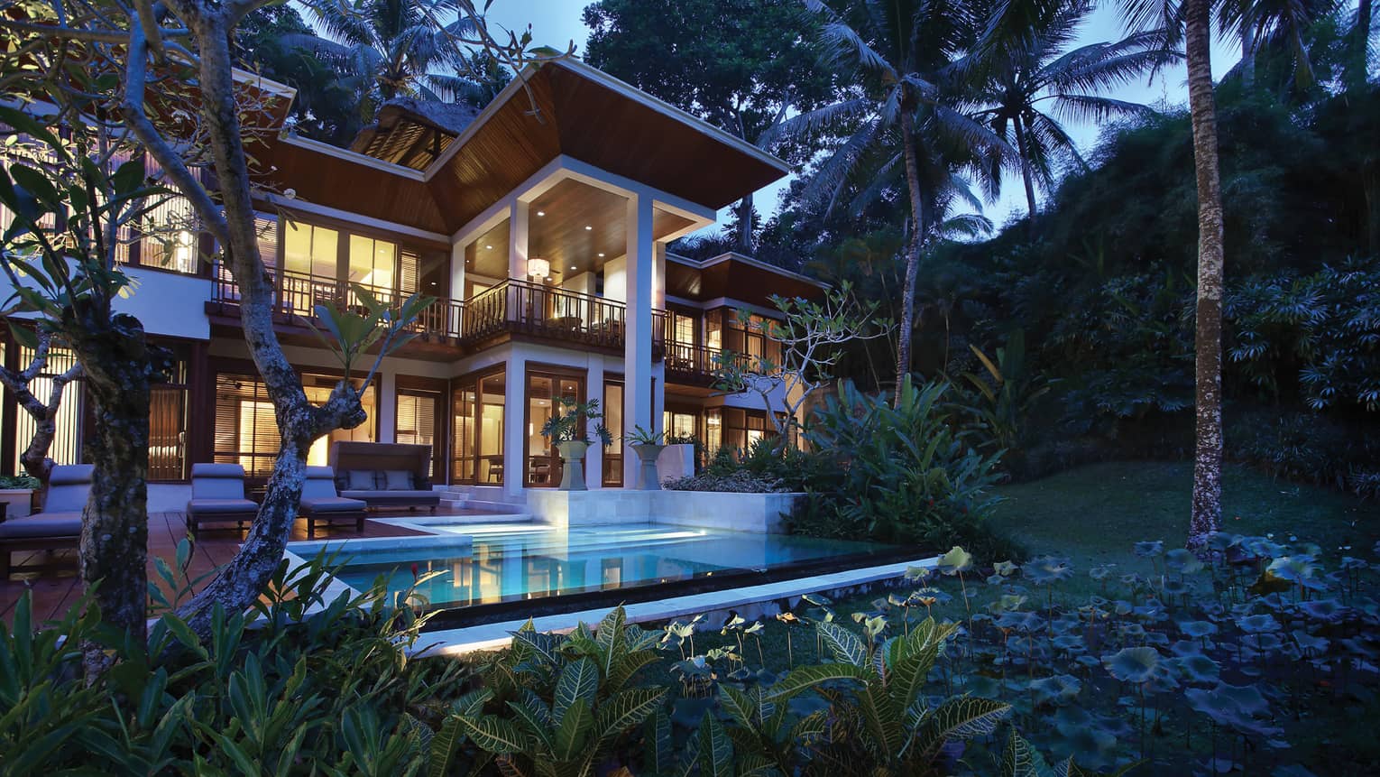 Private two-storey villa with pool at luxury resort surrounded by tropical greenery