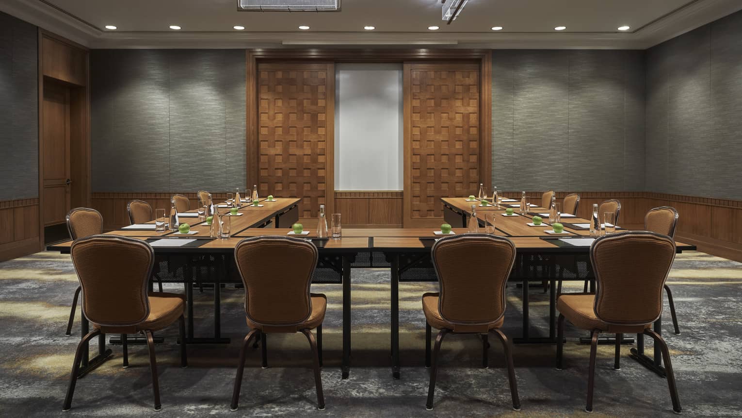A boardroom surrounded by chairs.