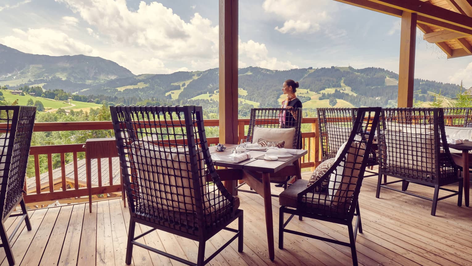 An outdoor dining and lounging area overlooking the breathtaking French Alps