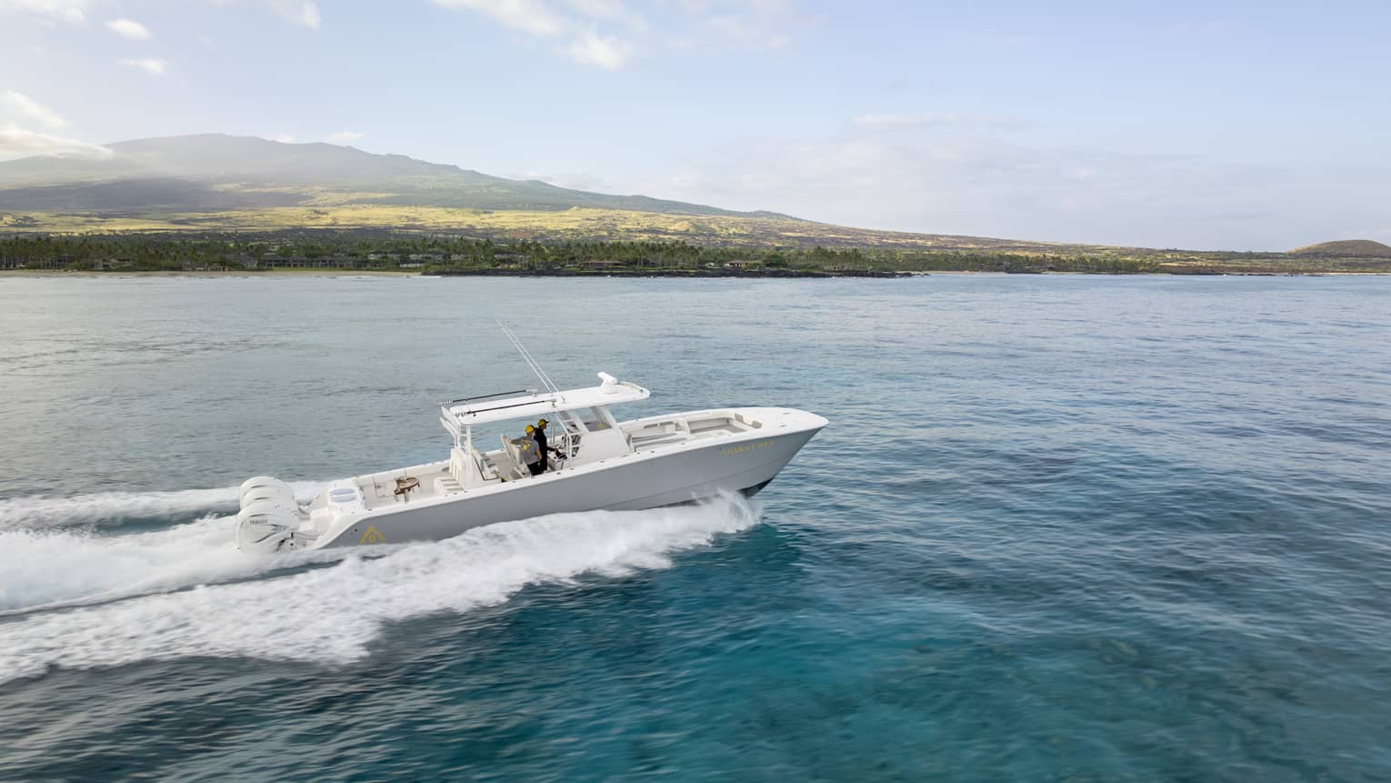 Boat on the water along Hawaii Island coast
