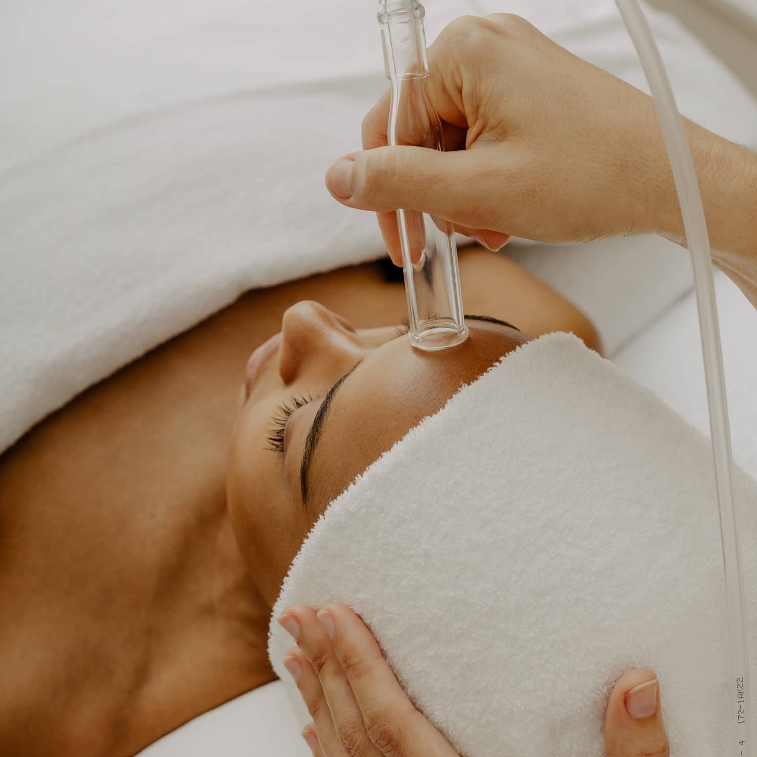 Woman gets a HydraFacial at spa