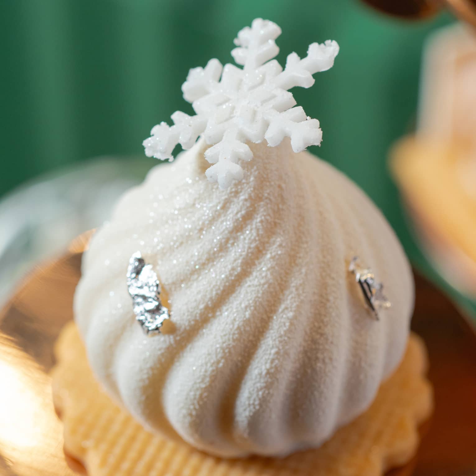 Festive afternoon tea pastry topped with a snowflake