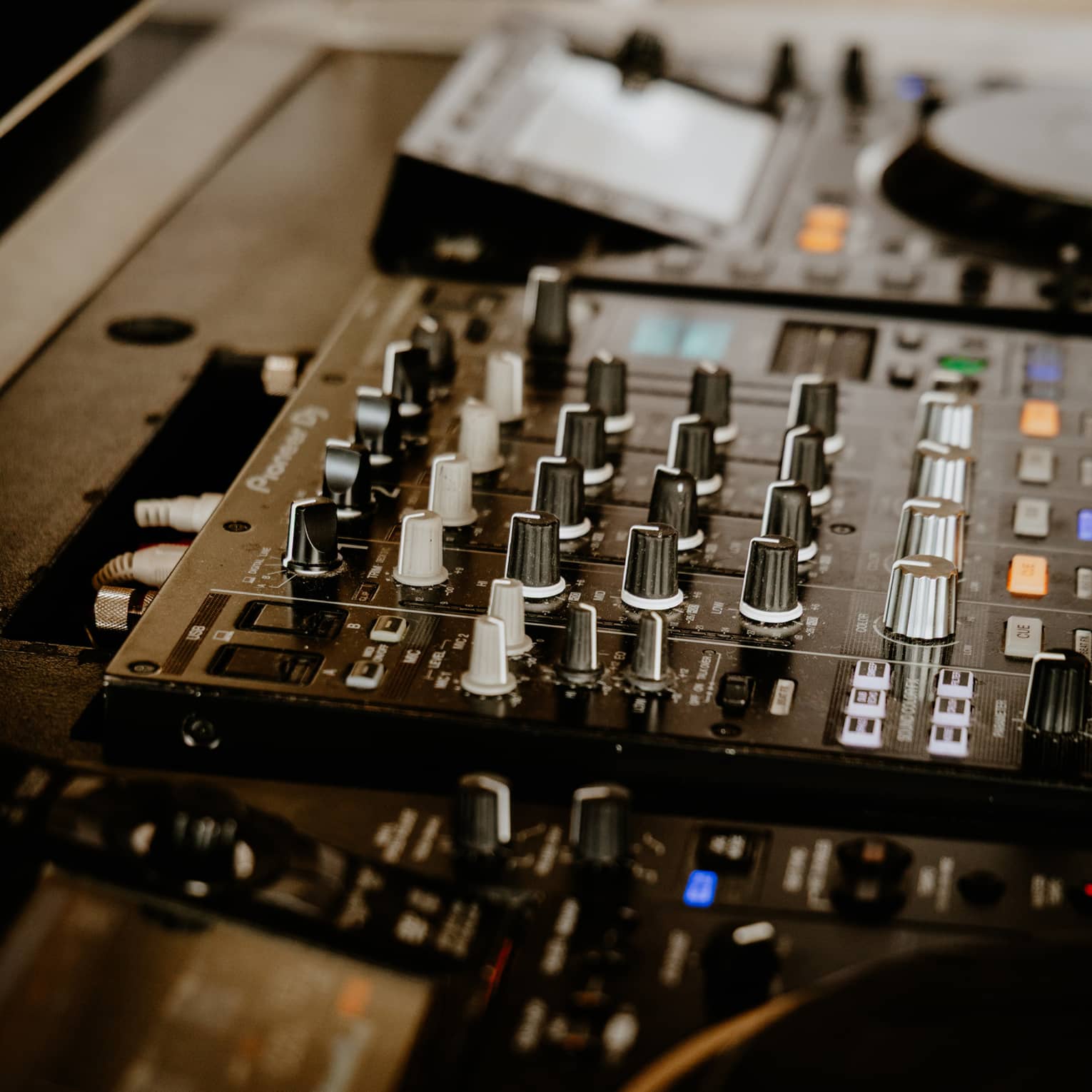 Close up of DJ console and mixing board