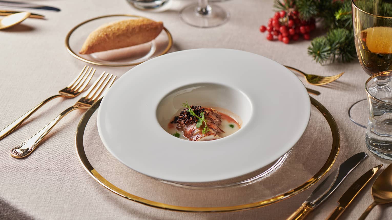 Elegant table setting with dish in round bowl in centre