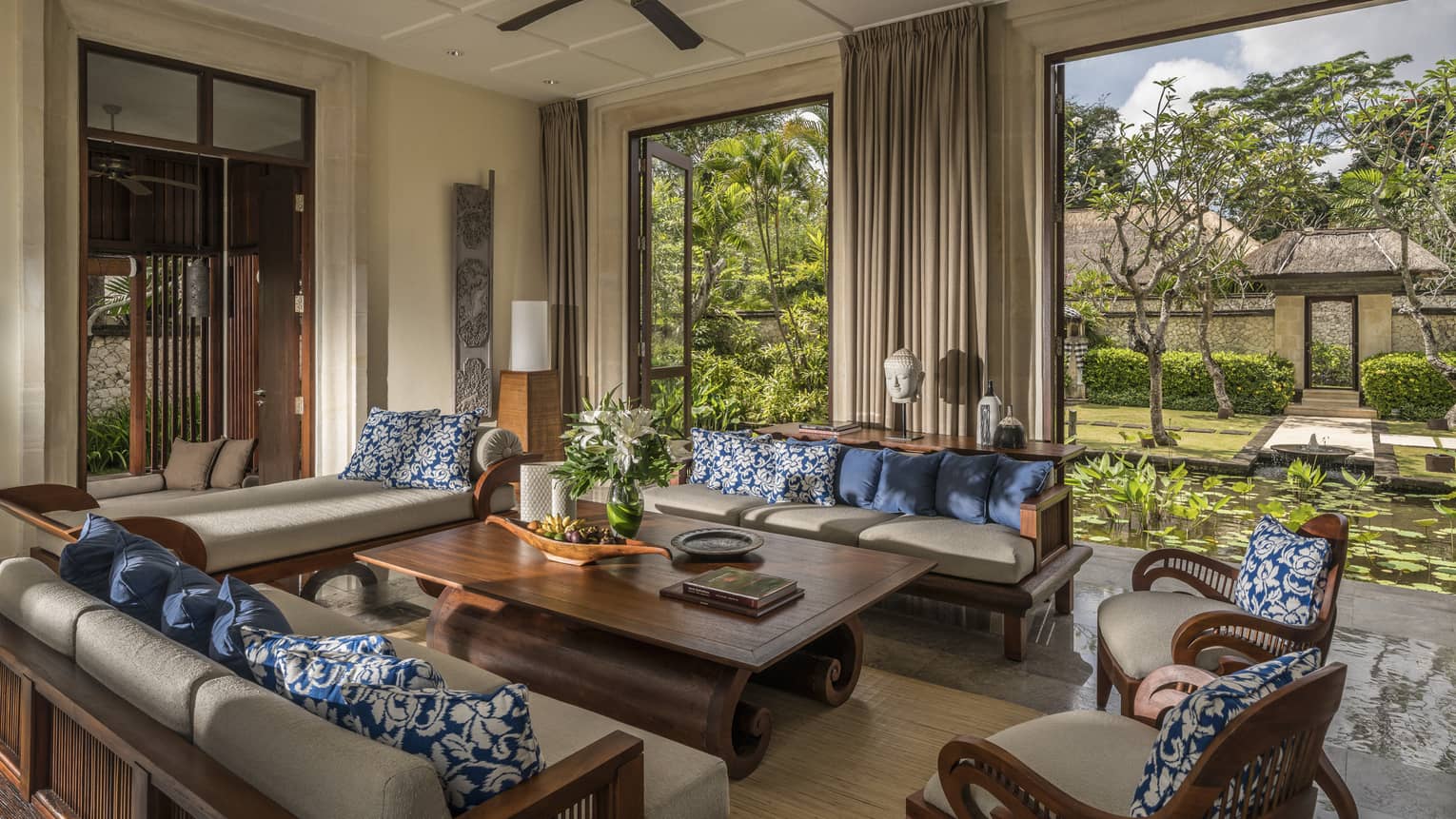 Sofas, table in open-air three-bedroom garden residence villa living room