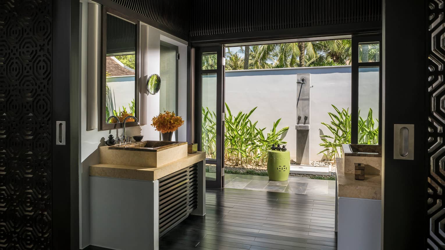 Sink, vanity in large bathroom with open wall to al fresco shower 