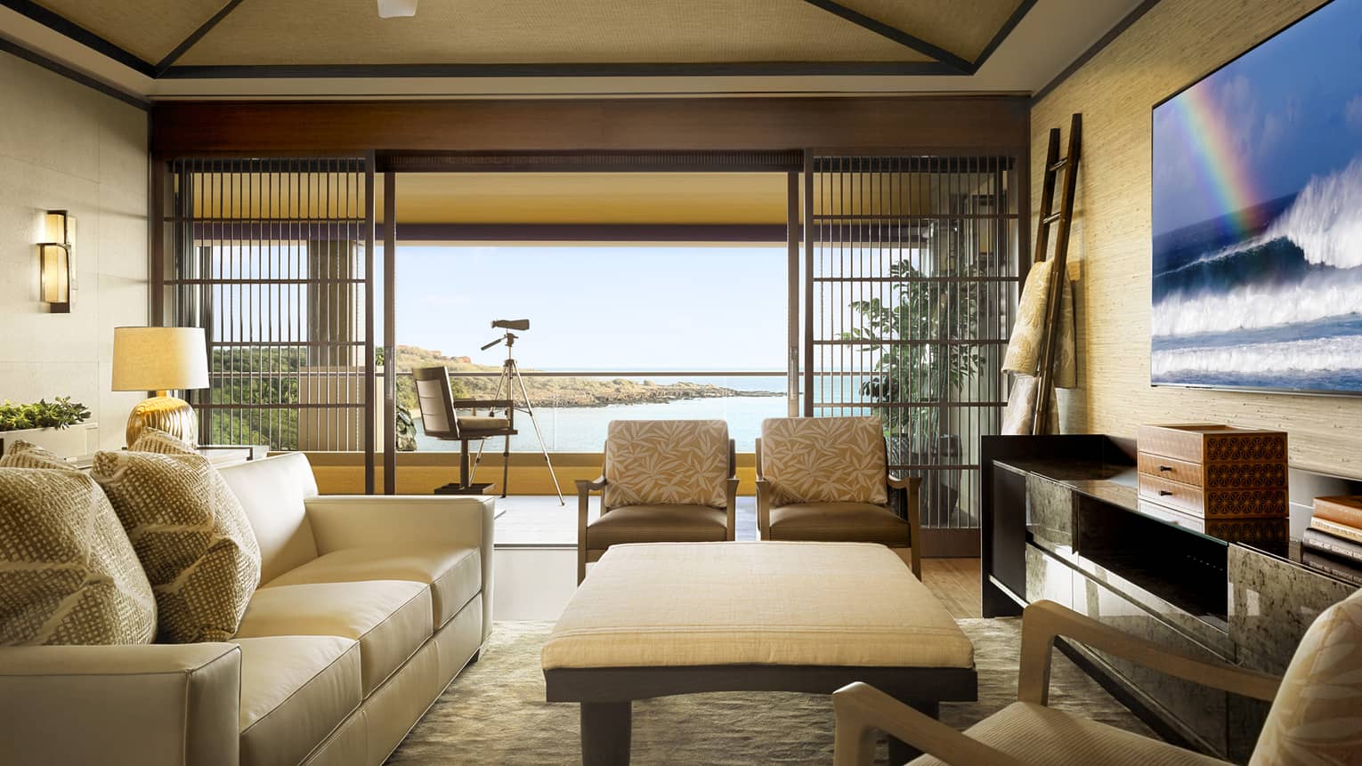 Alii Suite sitting room by large open wall to patio