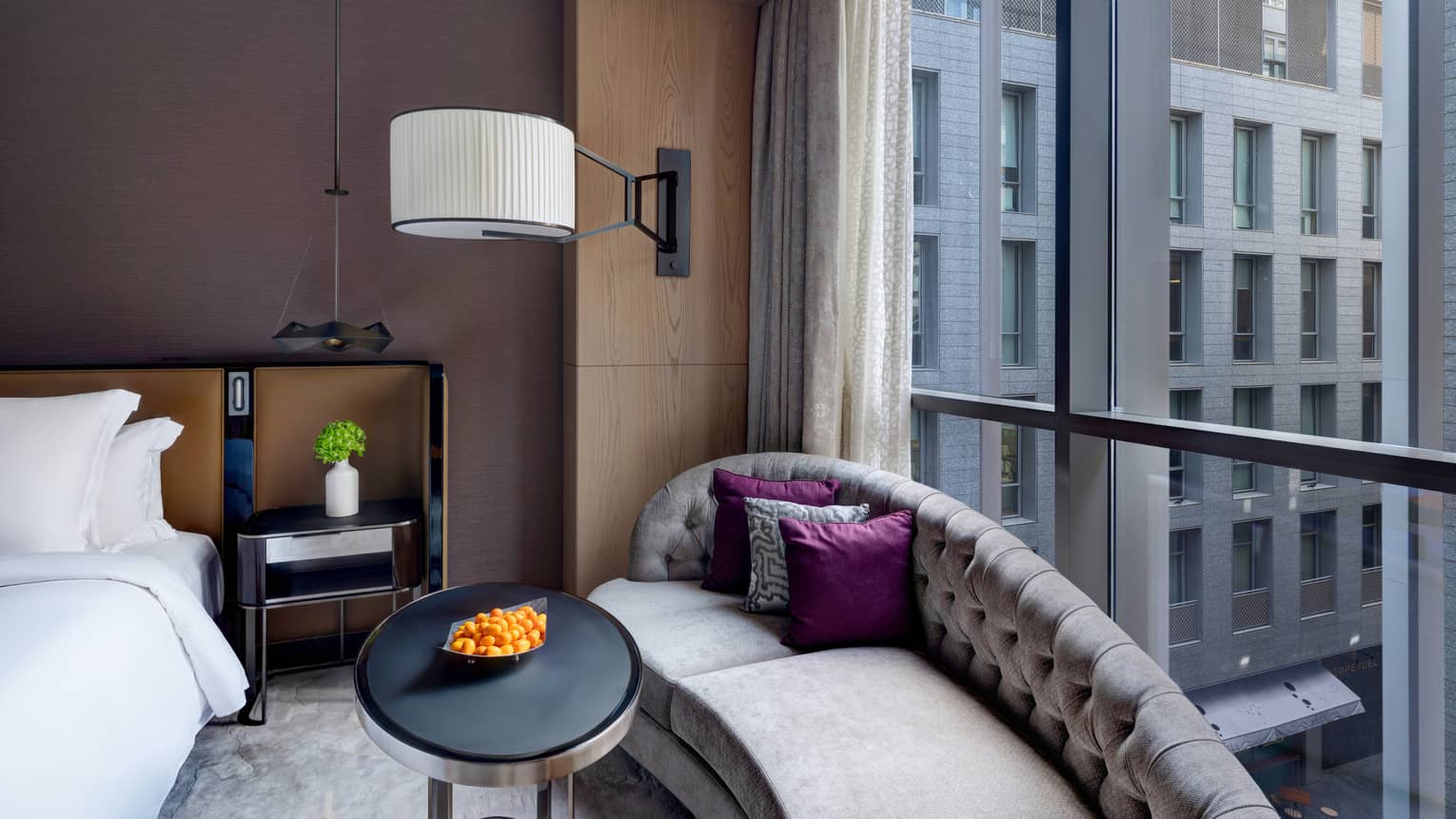 Bedroom with chaise lounge against the window