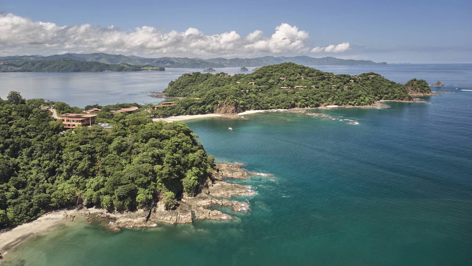 Aerial view of Peninsula Papagayo with mountains in the distance