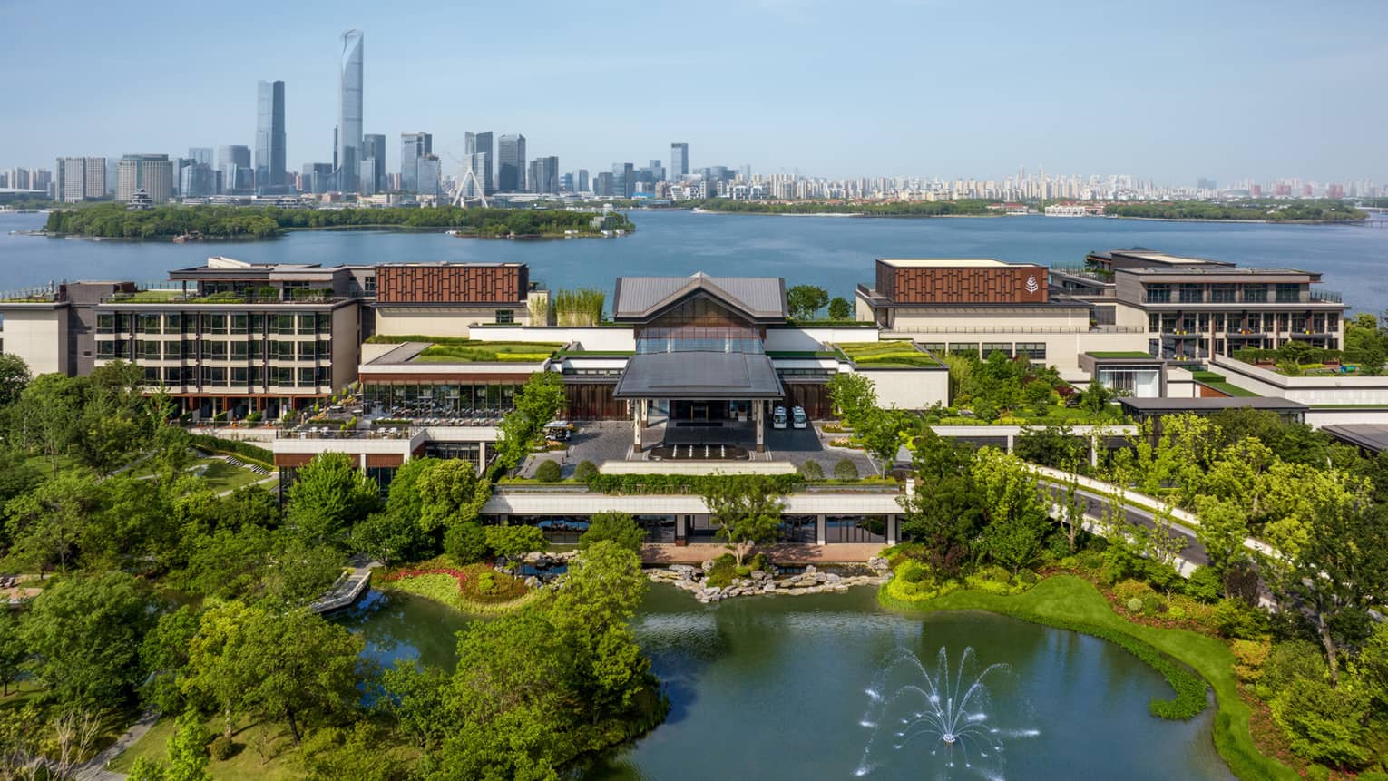 Exterior of Four Seasons Hotel Suzhou, with Jinji Lake and city centre in the background