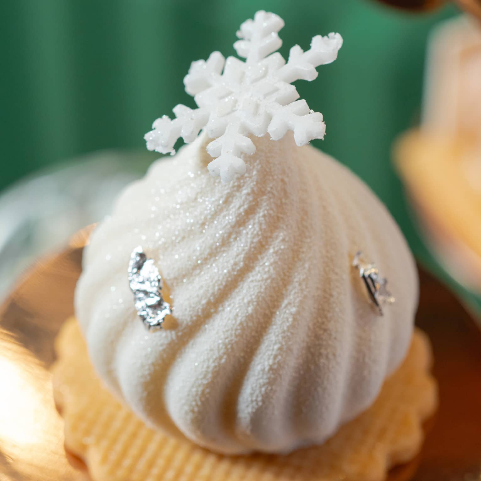 Festive afternoon tea pastry topped with a snowflake