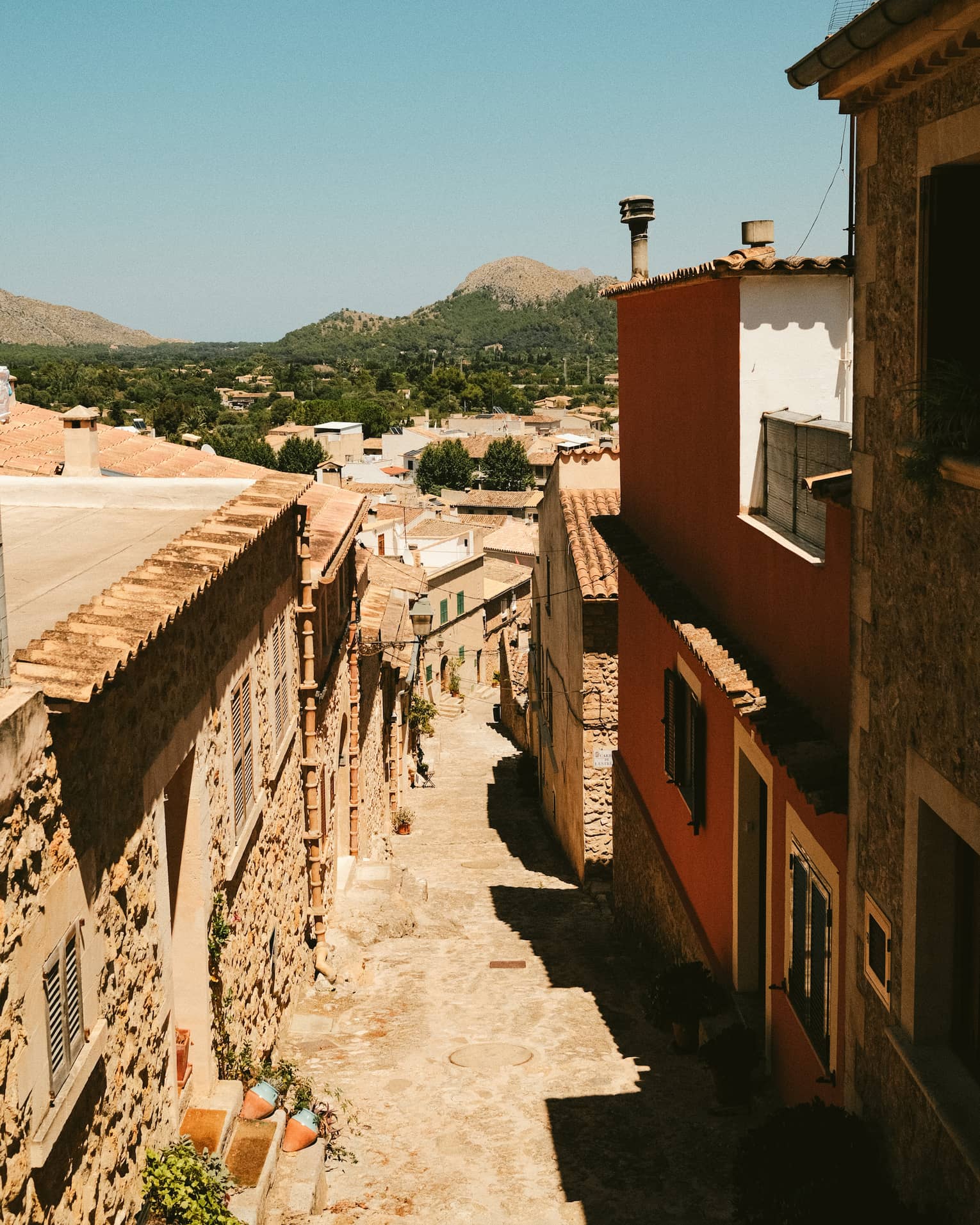 Cobblestone street lined with buildings