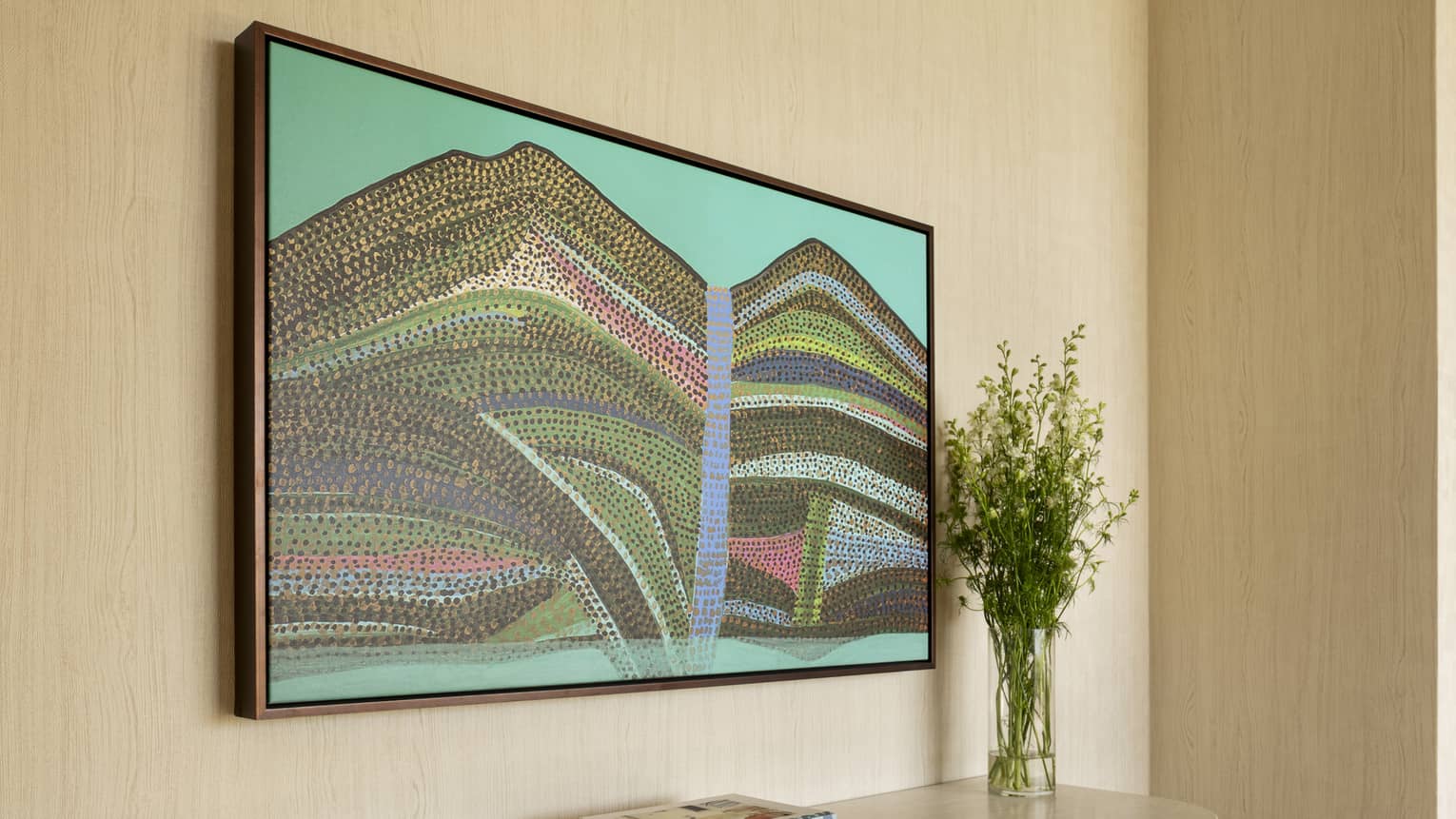 Contemporary resort suite hallway featuring an abstract Hawaiian painting above a dresser