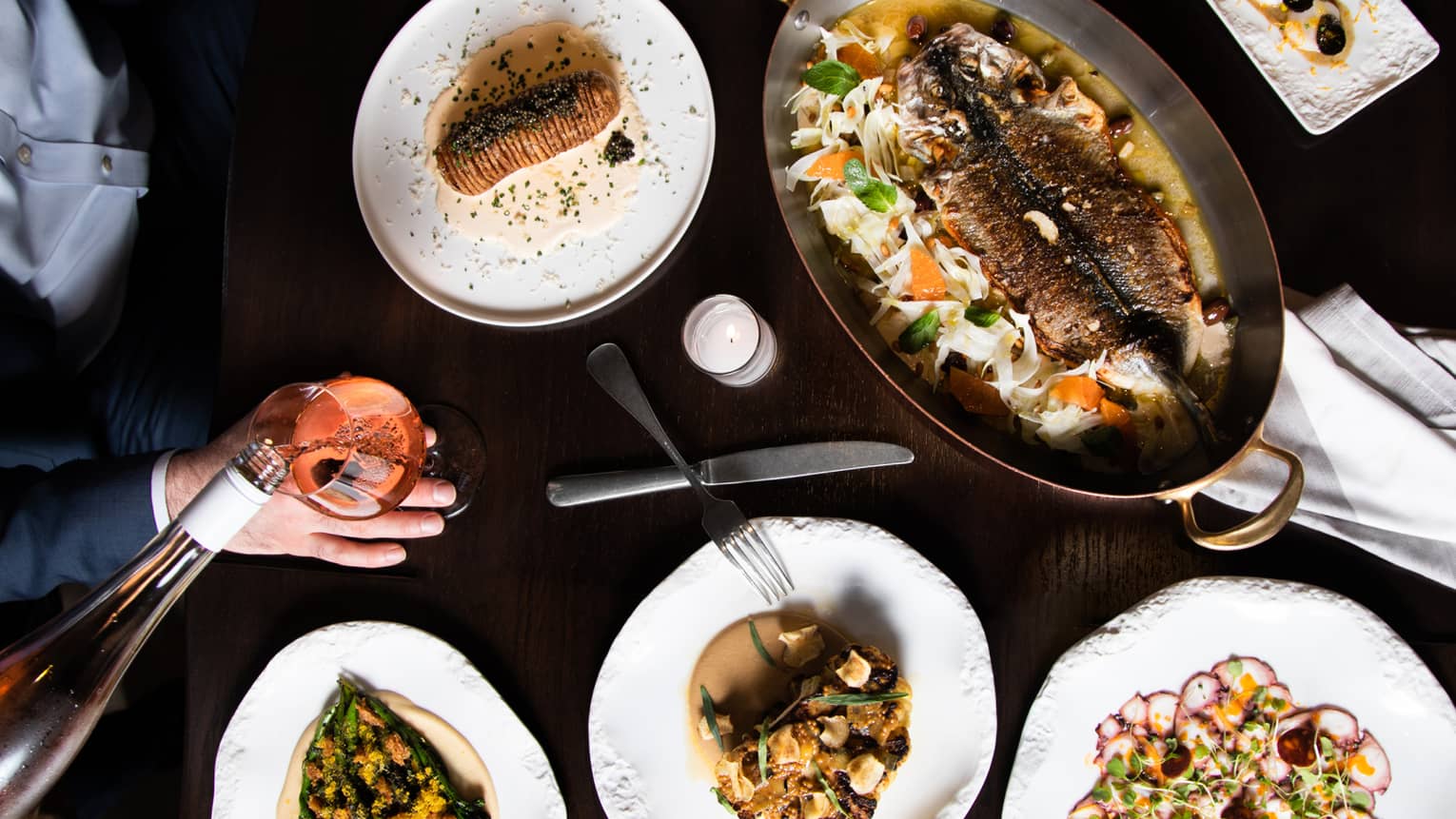 An assortment seafood on white plates.
