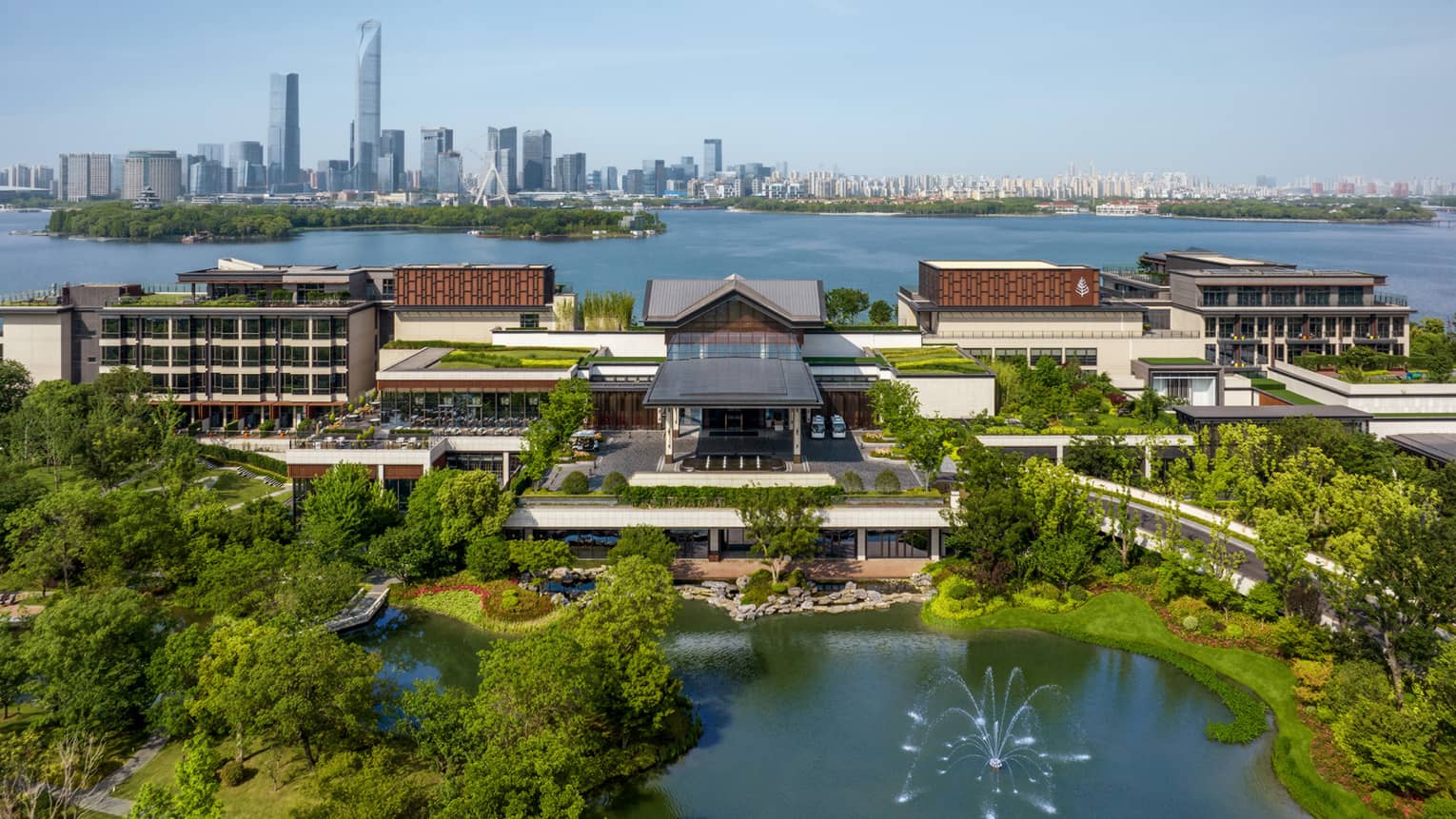 Exterior of Four Seasons Hotel Suzhou, with Jinji Lake and city centre in the background