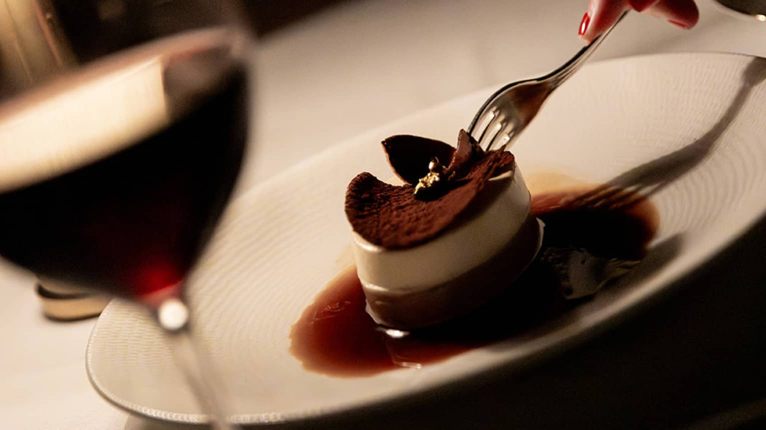 Tiramisu served on a large, white-rimmed platter