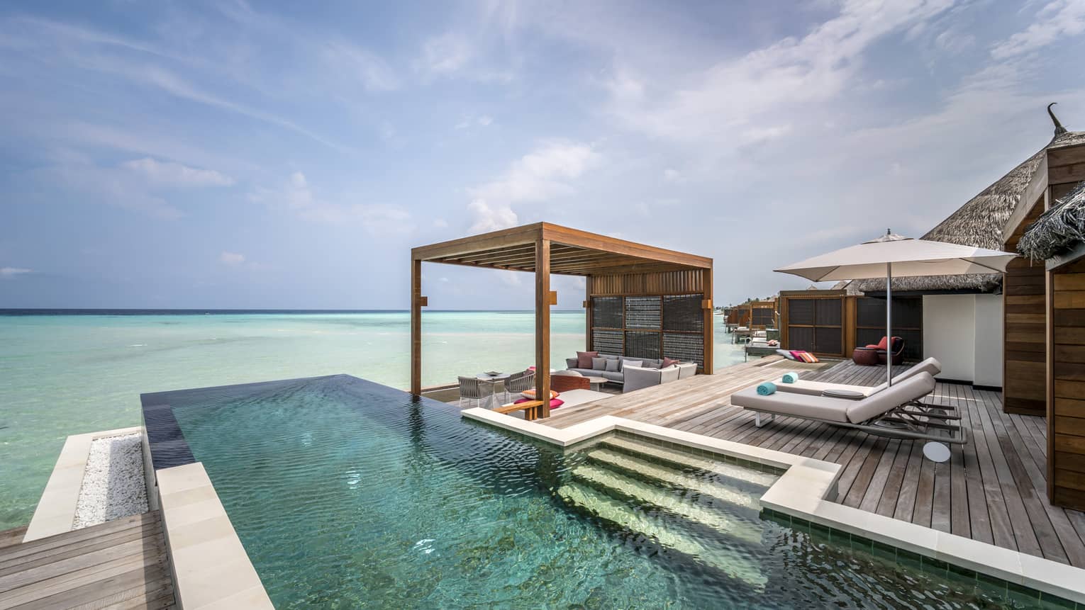 The infinity and sea view from the two-bedroom water suite
