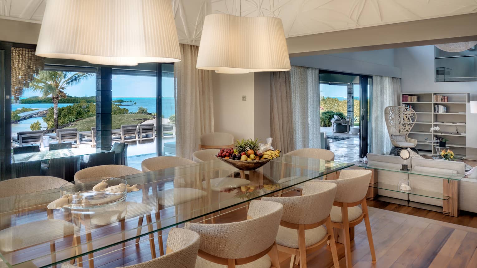 A contemporary kitchen table with ample seating set against incredible ocean views