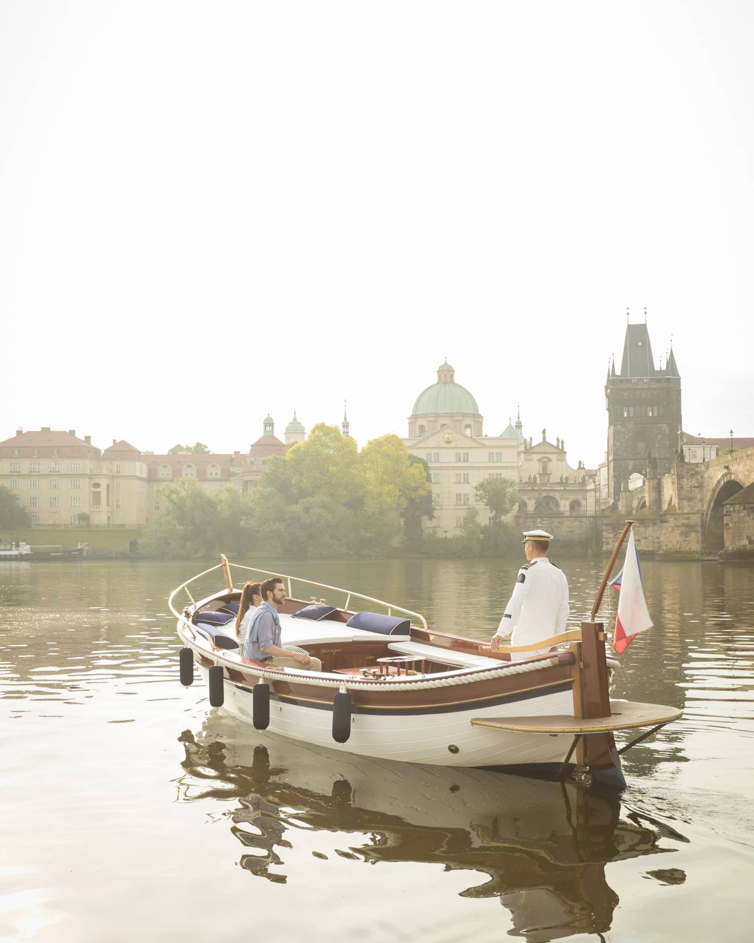 Couple enjoying river boat trip in Prague