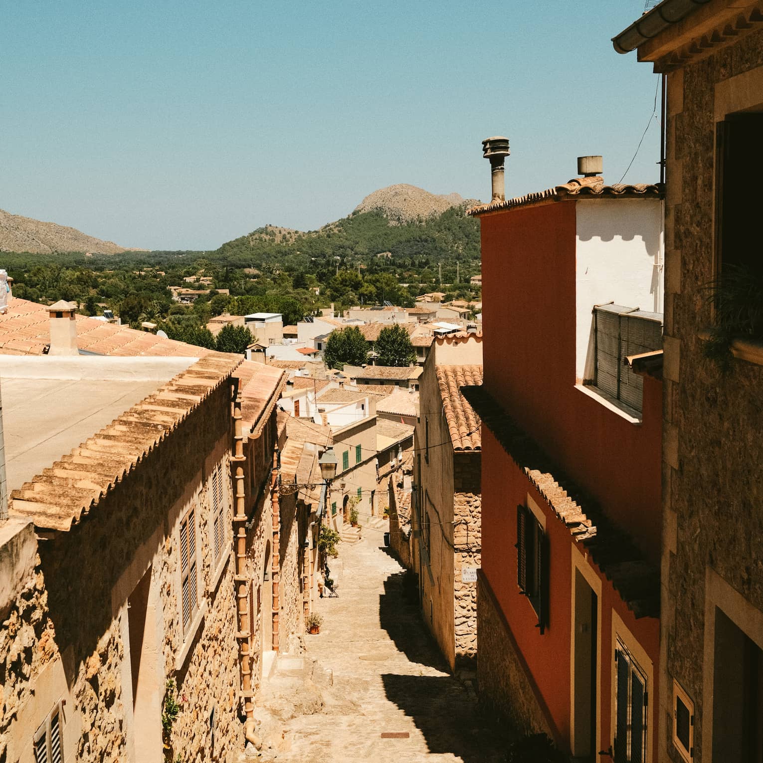 Cobblestone street lined with buildings