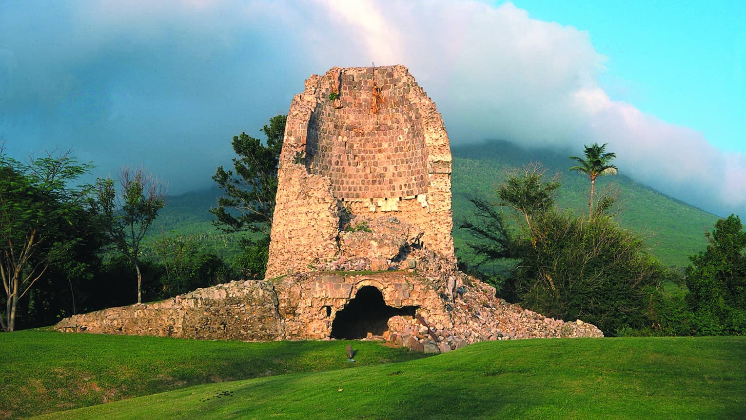 Large stone sugar mill ruins at second hole on golf course