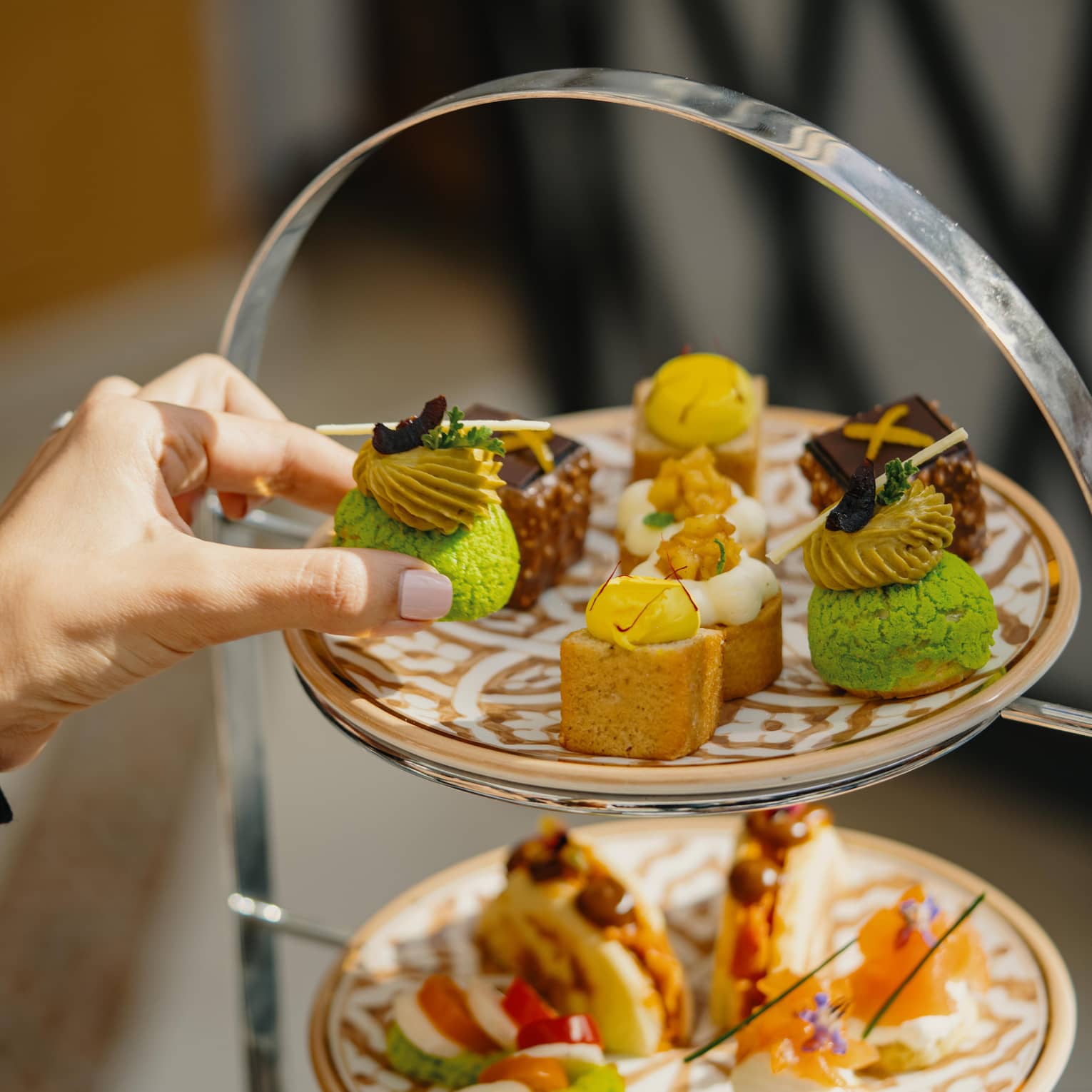 A spread of pastries on a three-tiered stand